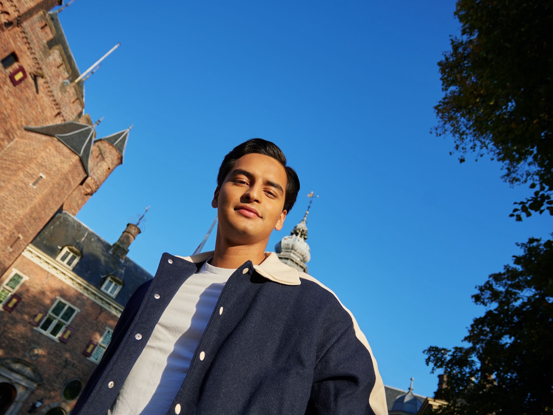 student in front of castle